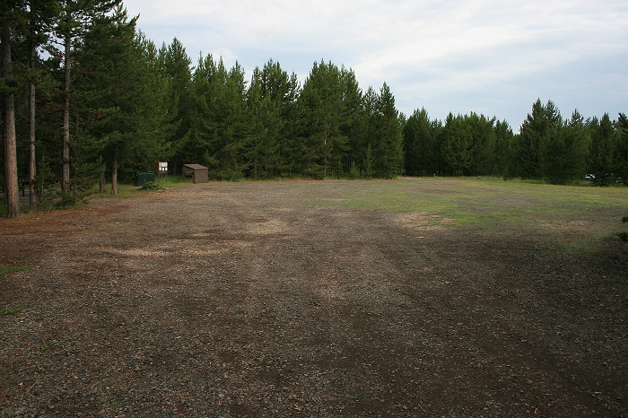 There is a large parking area in the center of the campsite loop for extra vehicles and RVs.
Notice the garbage dumpster on the left side of the parking area.