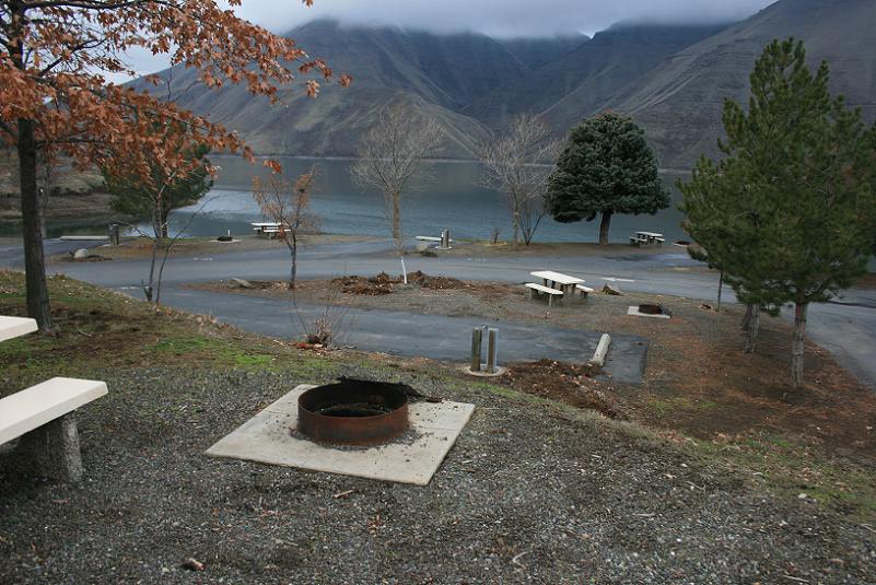 Picture of typical campsites in Woodhead Park Campground with Brownlee reservoir in the background.