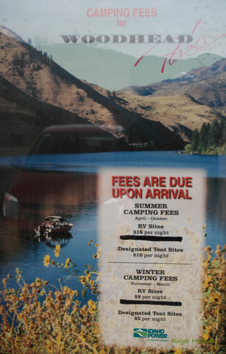 A picture of a poster with the camping fees for Woodhead Park.
