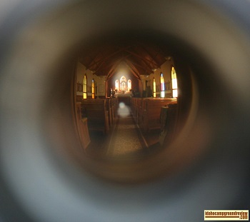 View of the interior of the Silver City Church through the front door peephole.