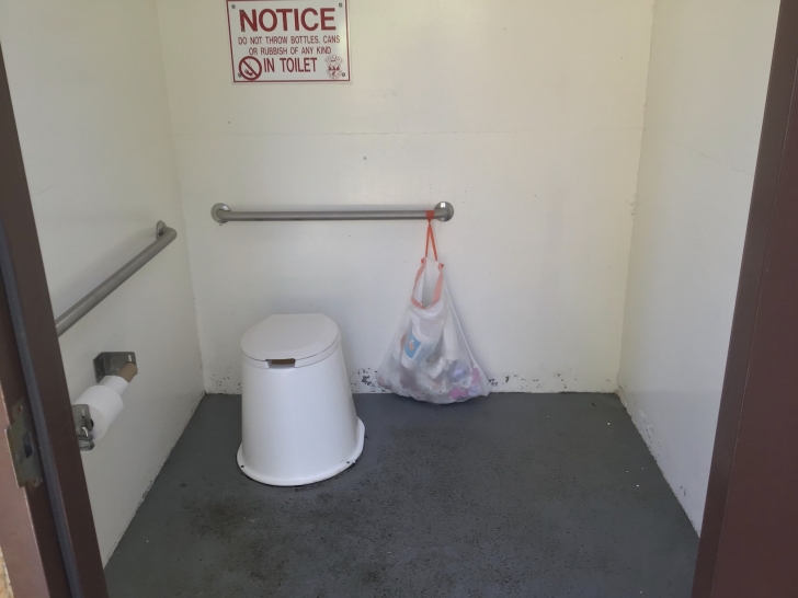 Typical interior view of the outhouses used in Horsethief Reservoir Campground.