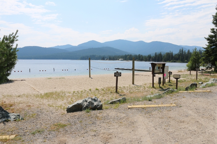 This picture shows the volleyball court, the swimming area, and Preist Lake.